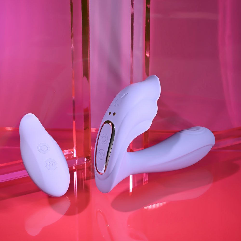 Playboy Pleasure LILAC FANTASY - 13.5 cm USB Rechargeable Tapping Vibrator with Remote on a pink background.