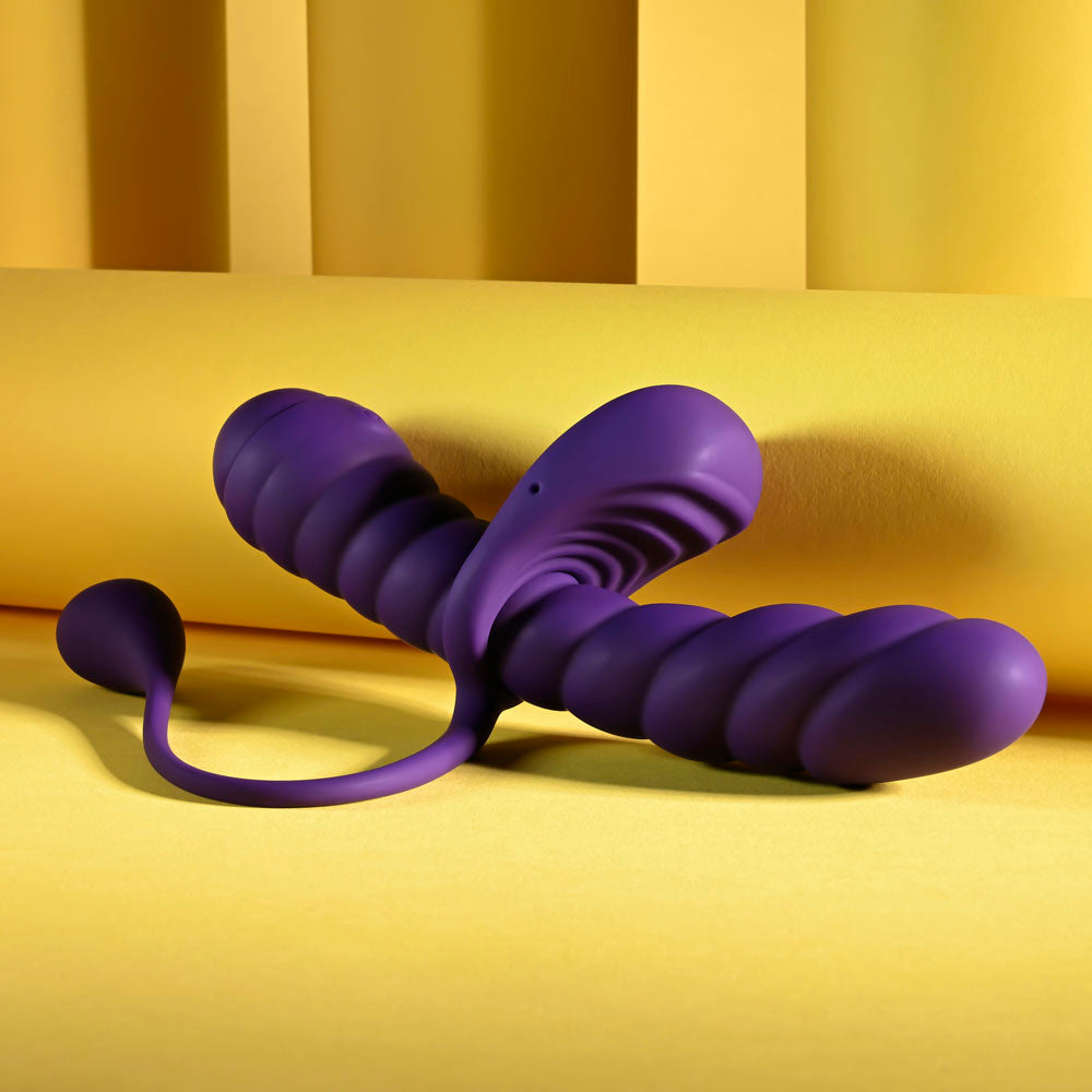 Playboy Pleasure TWISTED PLAYGROUND - USB Rechargeable Vibrator and Cock Ring Kit on a yellow background.