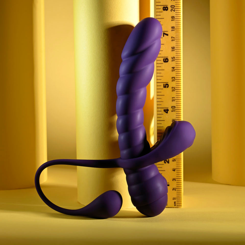 Playboy Pleasure TWISTED PLAYGROUND -  USB Rechargeable Vibrator and Cock Ring Kit on a yellow background