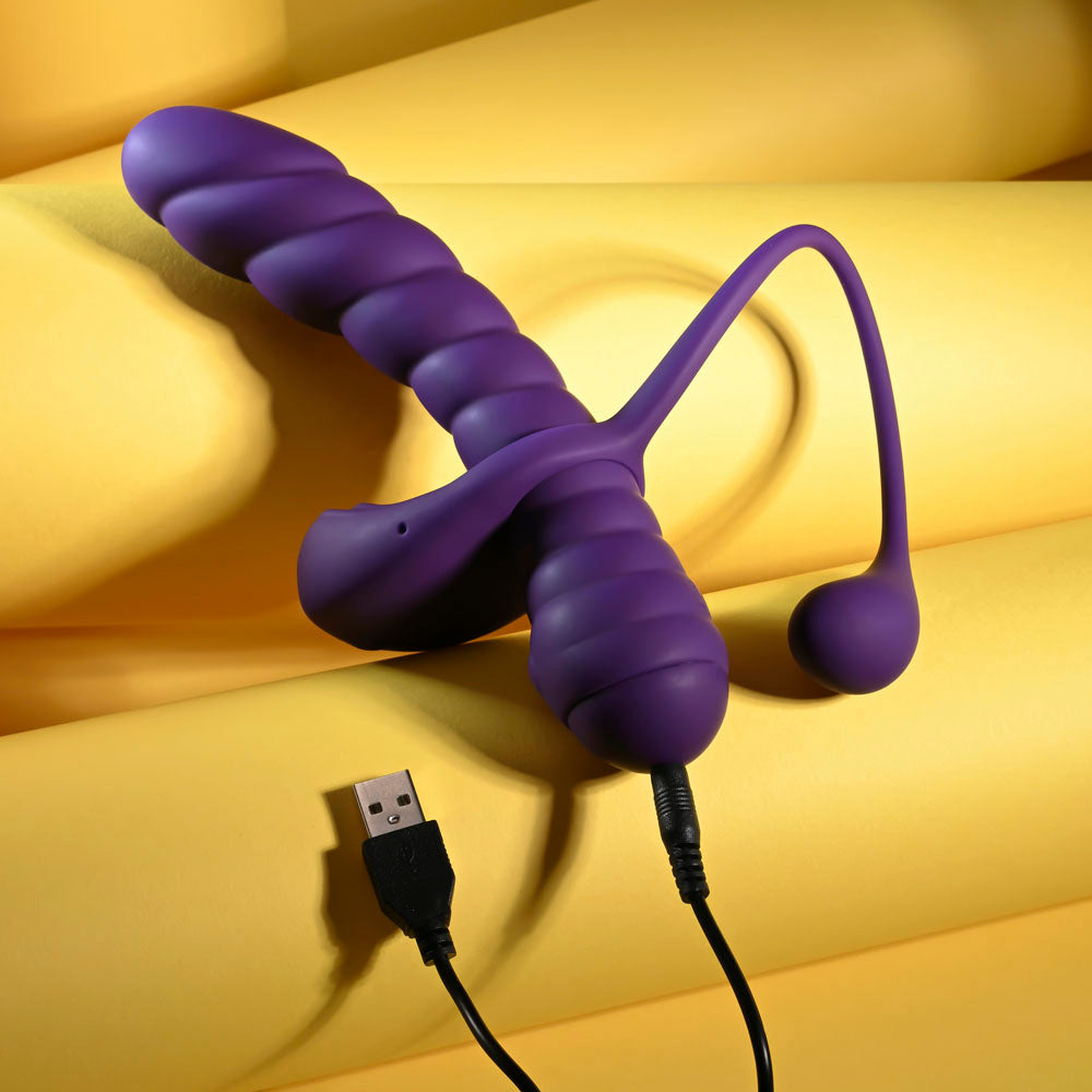 Playboy Pleasure TWISTED PLAYGROUND -  USB Rechargeable Vibrator and Cock Ring Kit on yellow background.
