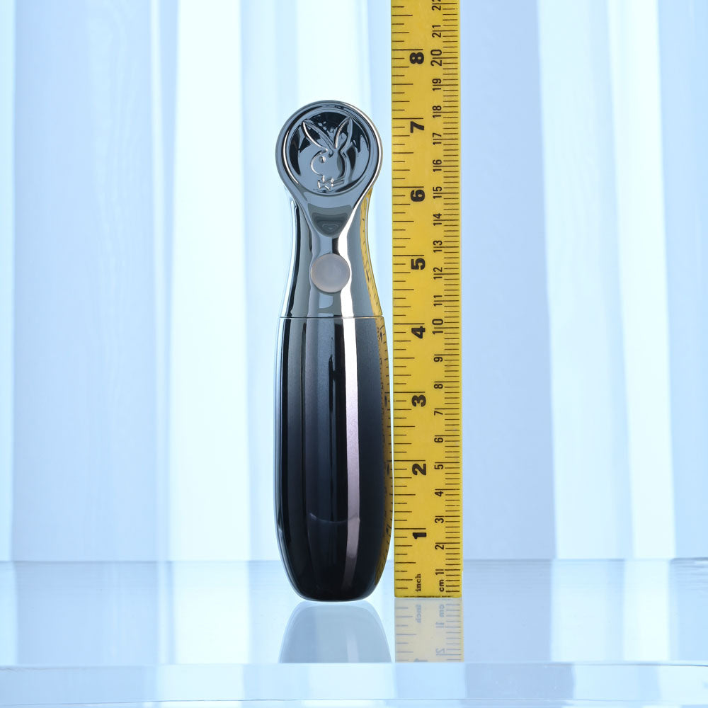 Playboy Pleasure BON VOYAGE - /Chrome 18.7 cm USB-C Rechargeable Tapping Vibrator next to a ruler for size reference.