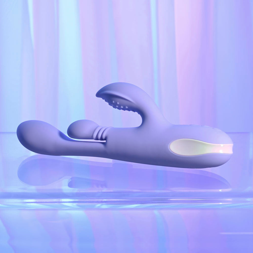 Playboy Pleasure NUBBIN RUBBIN - 24.1 cm USB Rechargeable Thrusting Rabbit Vibrator on display against a colorful background.