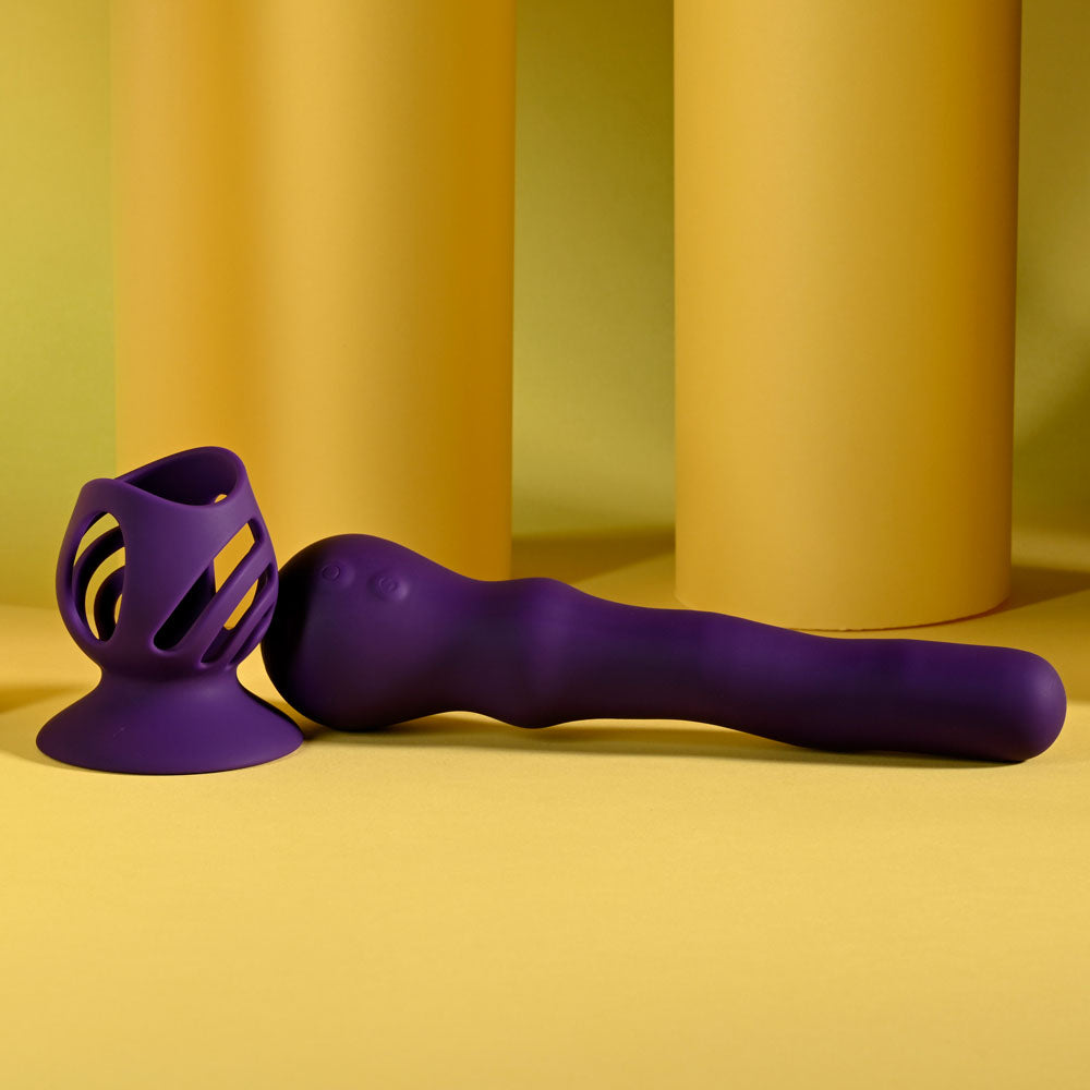 Playboy Pleasure WIGGLE IT 23.9 cm USB Rechargeable Wiggling Vibrator on a yellow background.