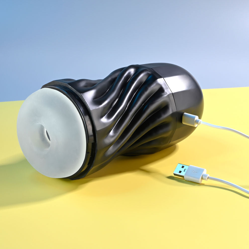 Playboy Pleasure SOLO - USB Rechargeable Vibrating and Sucking Stroker on a yellow background, showcasing its unique design.