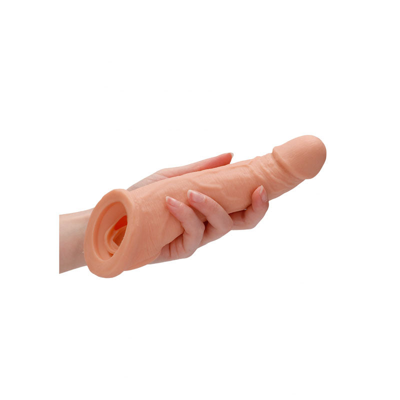 REALROCK 8'' Realistic Penis Extender with Rings -  20.3 cm Penis Extension Sleeve held in a hand.