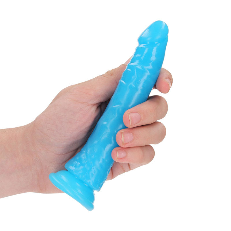 REALROCK 15.5 cm Slim Glow in the Dark Neon -  - Glow in Dark  15.5 cm (6'') Dong held in hand, showcasing its texture and design.