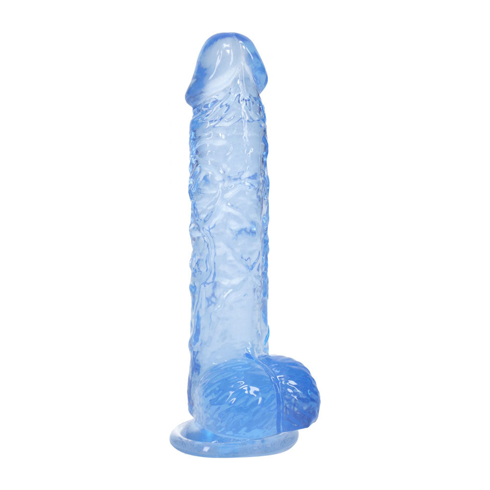 REALROCK 5'' Crystal Clear Dildo with Balls -  - Clear  14.7 cm Dong on a suction cup surface.
