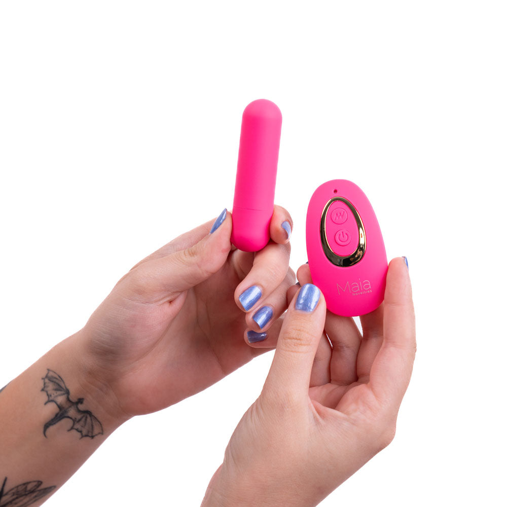 Maia JESSI Remote -  7.6 cm USB Rechargeable Bullet with Wireless Remote in pink held in hands.
