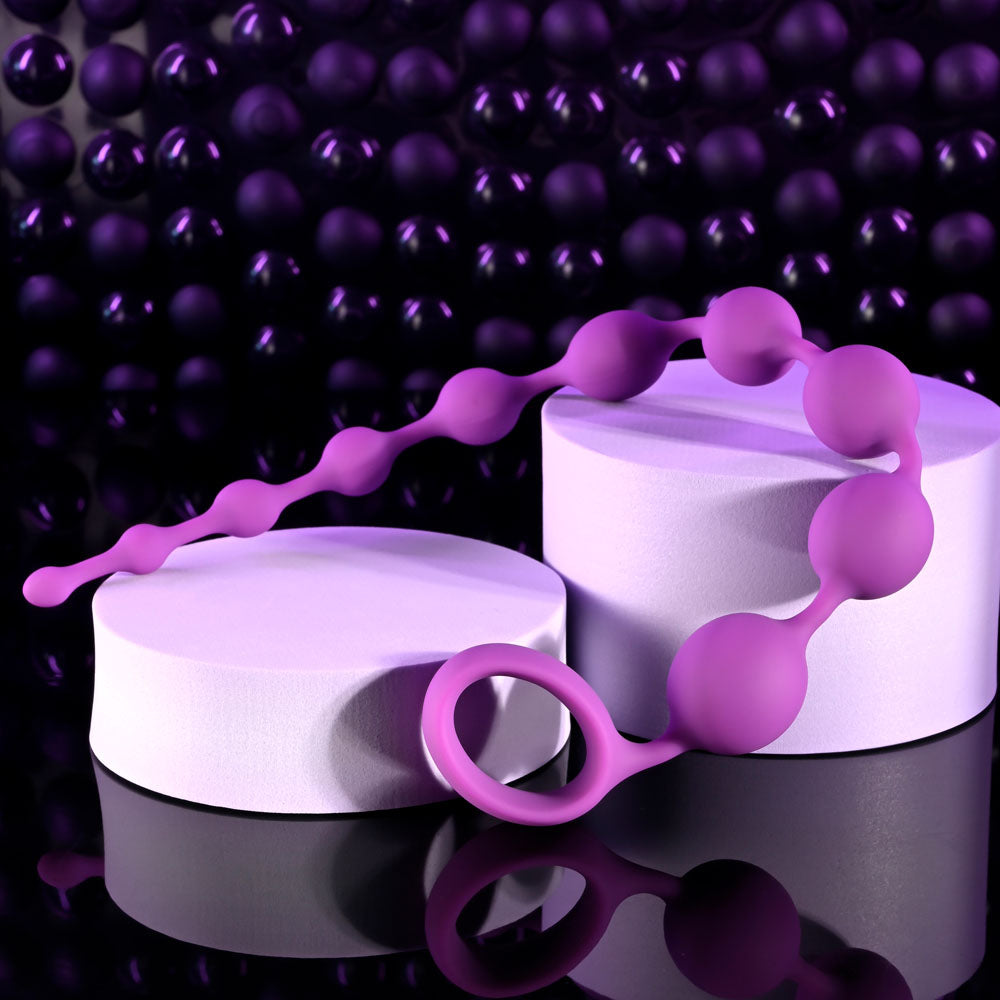 Selopa BEADED ADVENTURE -  35.5 cm Anal Beads displayed on a reflective surface with purple background.