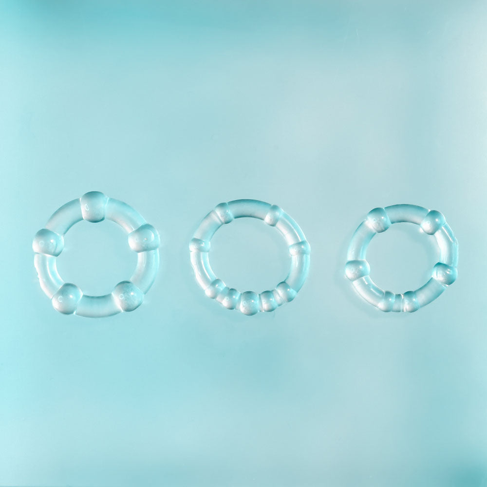 Selopa ERECTION RINGS - Cock Rings - Set of 3 displayed on a light blue background, showing different ring designs.