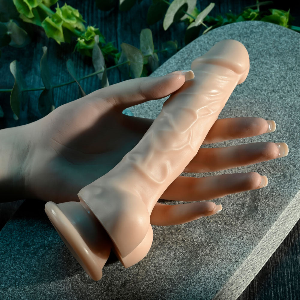 Selopa 6'' DILDO - Light - 19 cm Dong held in hand, highlighting its realistic design and suction cup.