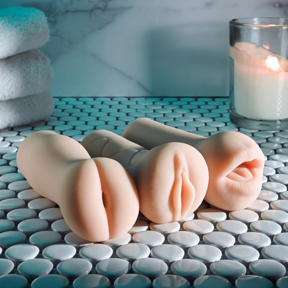 Selopa PARTY PACK - Light -  Strokers - Set of 3 displayed on a tiled surface with candles and towels.