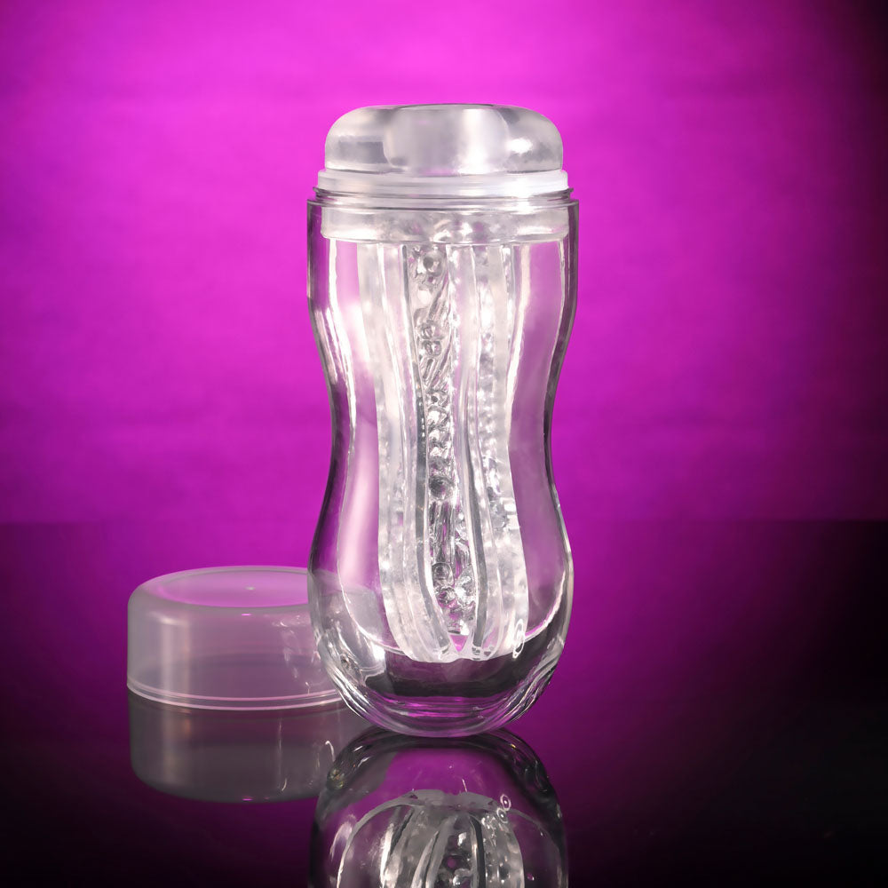 Selopa STROKE OF LUCK - Stroker portable masturbator with beaded inner channel on a pink background.