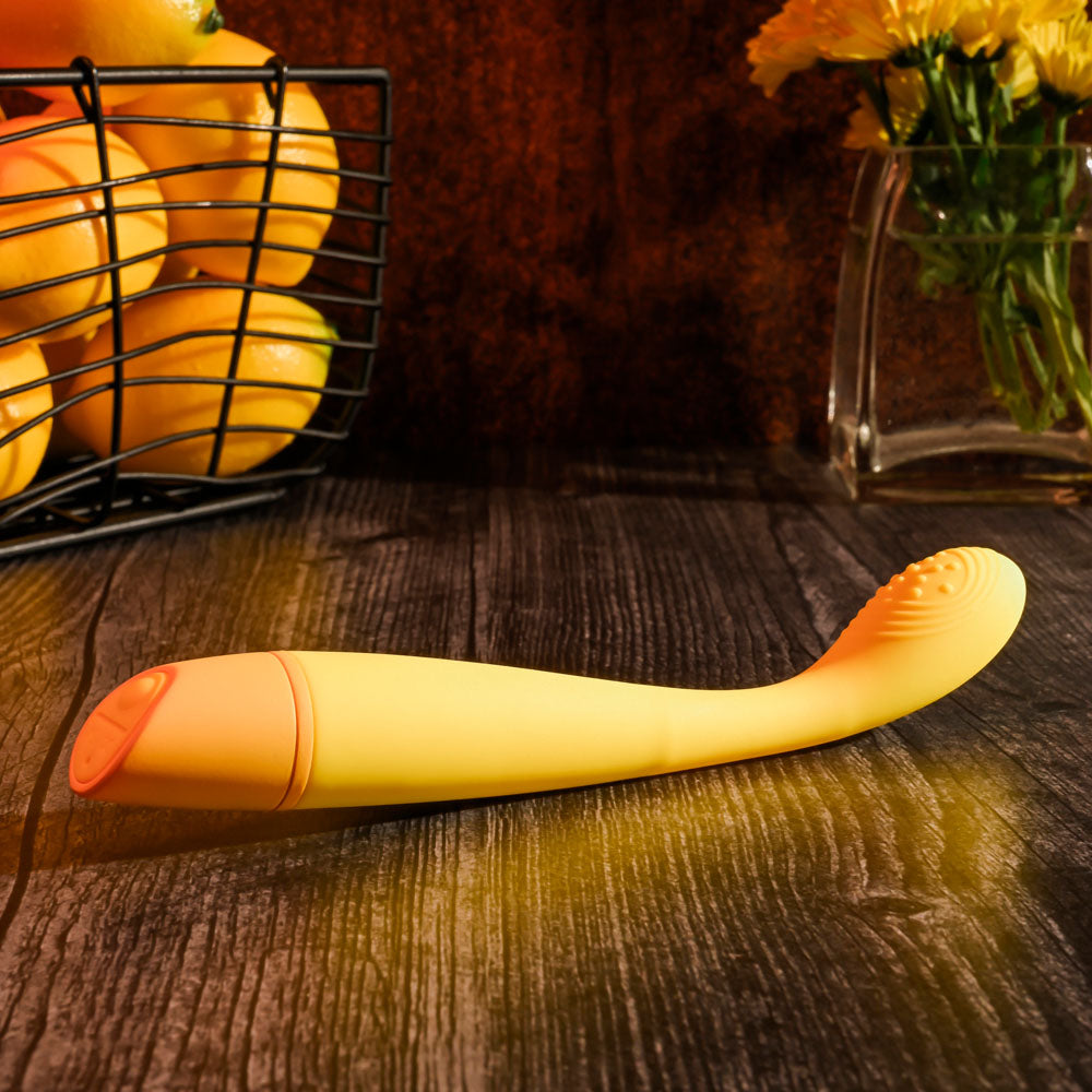Selopa LEMON SQUEEZE -  18.4 cm USB Rechargeable Vibrator on a wooden surface with lemons in the background.