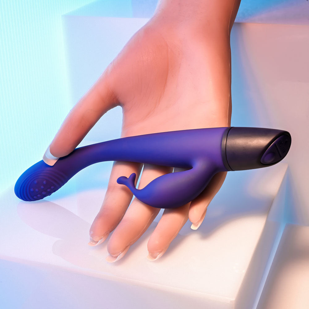 Selopa PLUM PASSION -  18.3 cm USB Rechargeable Rabbit Vibrator held in hand, showcasing design and features.