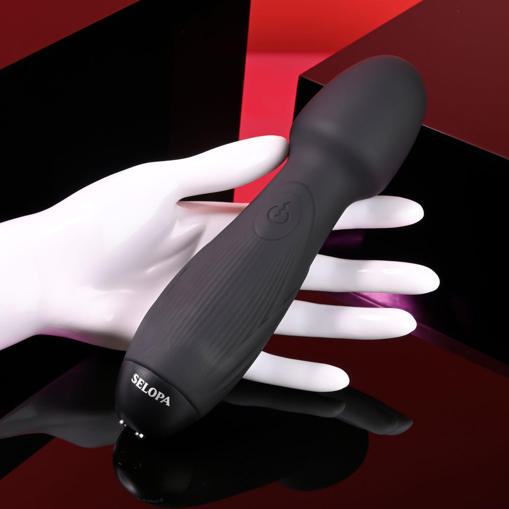 Selopa POWER TRIP - 18.8 cm USB Rechargeable Massage Wand displayed on a hand against a stylish background.