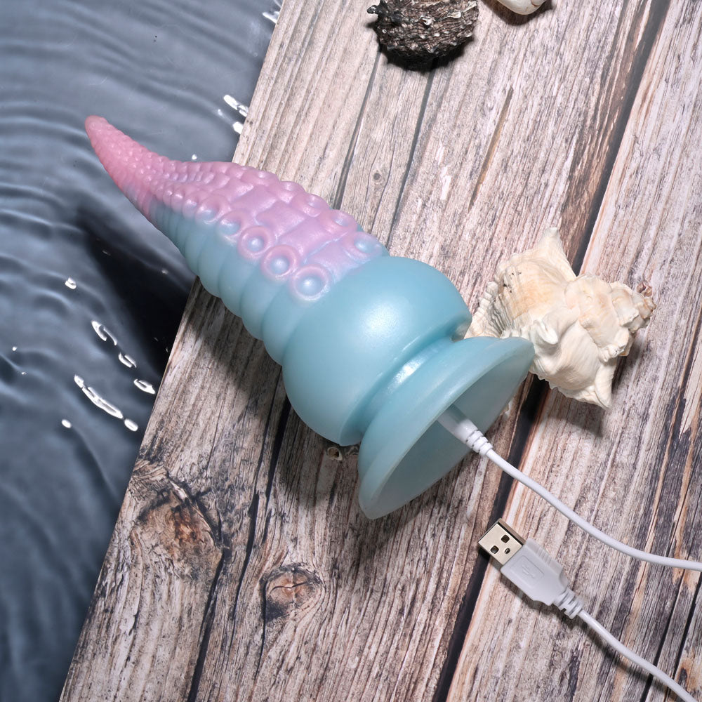Selopa STUCK ON YOU - Blue/Pink 19 cm USB Rechargeable Vibrating Tentacle Fantasy Dildo on wooden surface with shells.