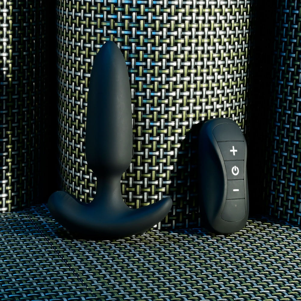 Selopa  BEAUTY -  11.3 cm USB Rechargeable Vibrating Butt Plug with Wireless Remote on a textured surface.