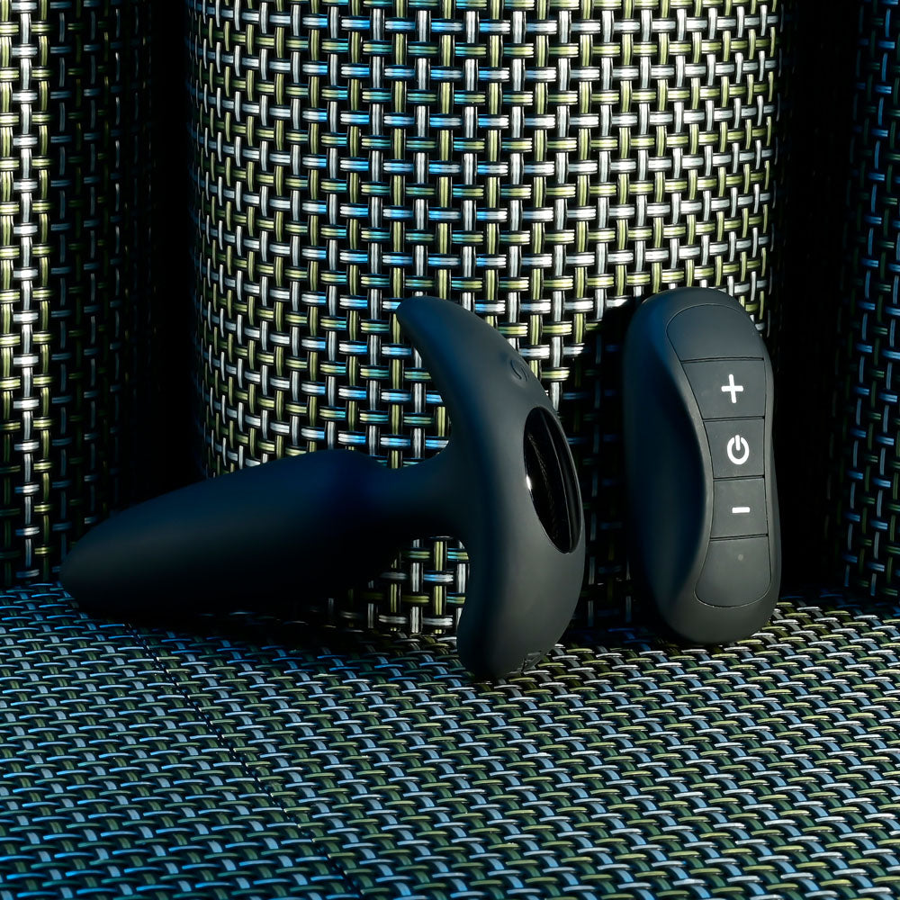 Selopa BEAUTY - 11.3 cm USB Rechargeable Vibrating Butt Plug with Wireless Remote on a textured surface.