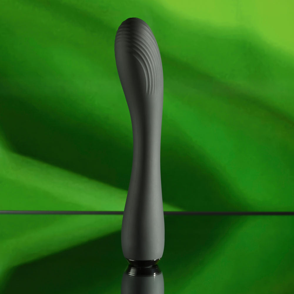 Selopa MIDNIGHT MAGIC - 20.2 cm USB Rechargeable Vibrator on a reflective surface with green background.