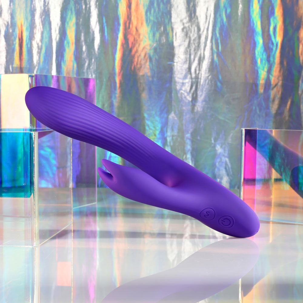Selopa POSEABLE BUNNY - 21 cm USB Rechargeable Poseable Rabbit Vibrator displayed against a colorful holographic background.