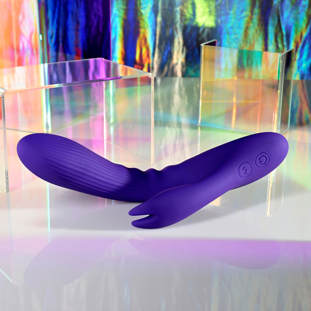 Selopa POSEABLE BUNNY - 21 cm USB Rechargeable Poseable Rabbit Vibrator on a colorful reflective surface.