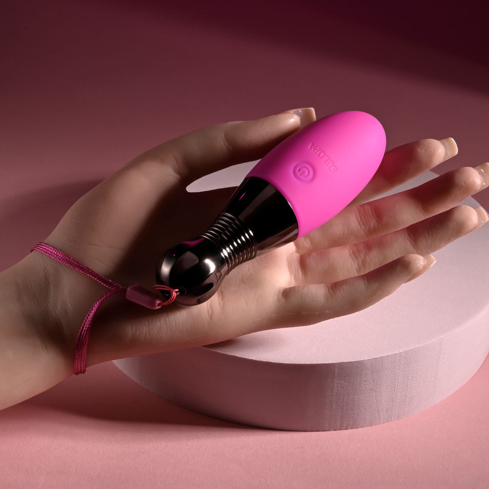 Selopa COMPANION -  11.9 cm USB Rechargeable Vibrating Egg held in hand, showcasing its sleek design and vibrant color.
