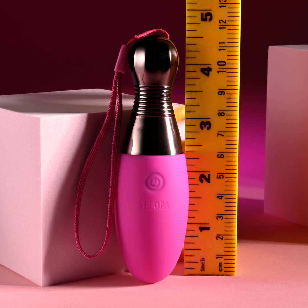 Selopa COMPANION - 11.9 cm USB Rechargeable Vibrating Egg next to a ruler for size reference.