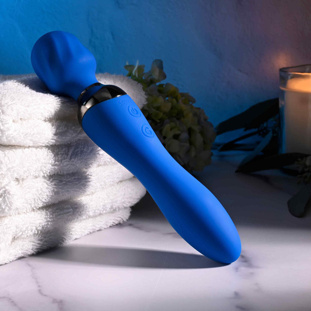 Selopa BELLE USB rechargeable massage wand on towels, showcasing sleek blue design and textured head.