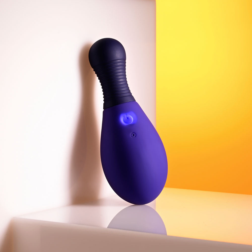 Selopa EGG ME ON - 10 cm USB Rechargeable Egg with Wireless Remote, purple vibrating egg against a vibrant background.