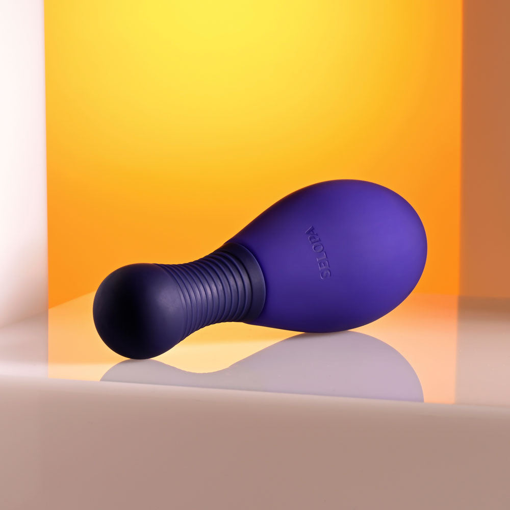 Selopa EGG ME ON -  10 cm USB Rechargeable Egg with Wireless Remote on a stylish surface.