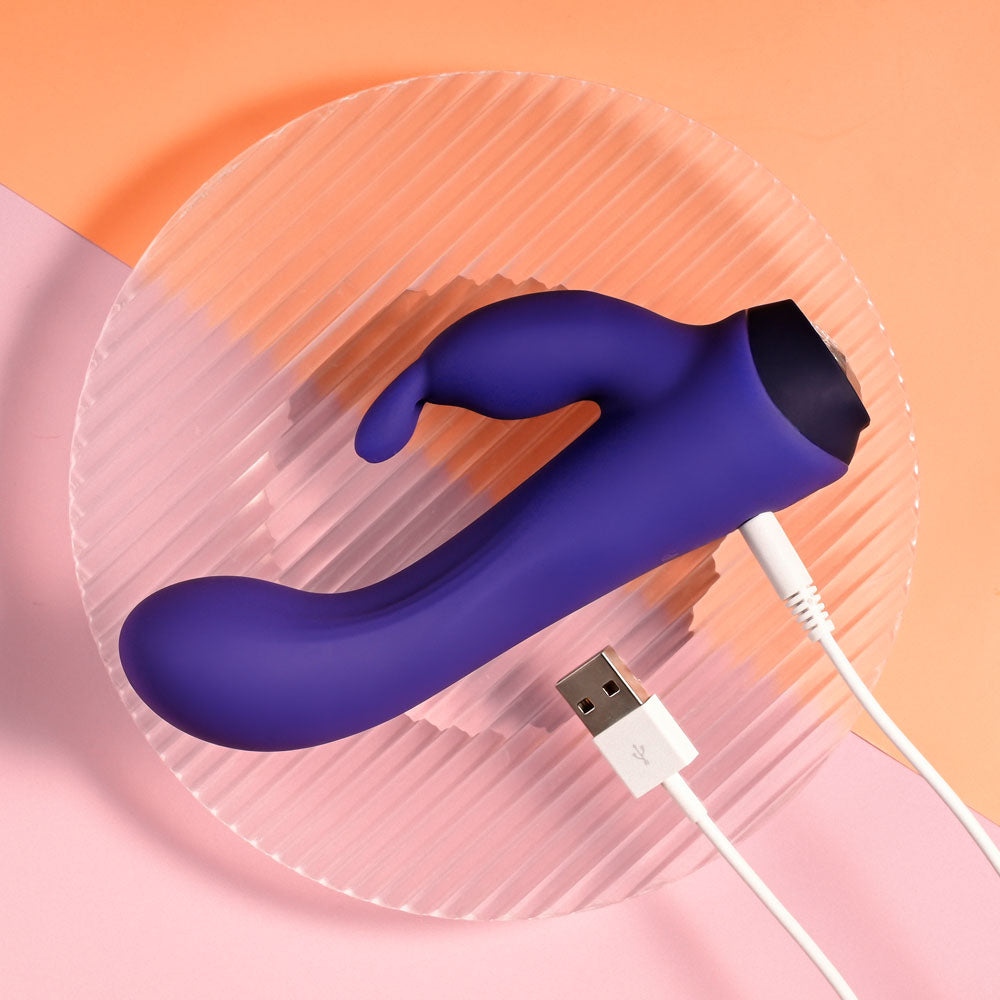 Selopa PLUM JOB - 13.5 cm USB Rechargeable Rabbit Vibrator on a round dish with USB charging cable.