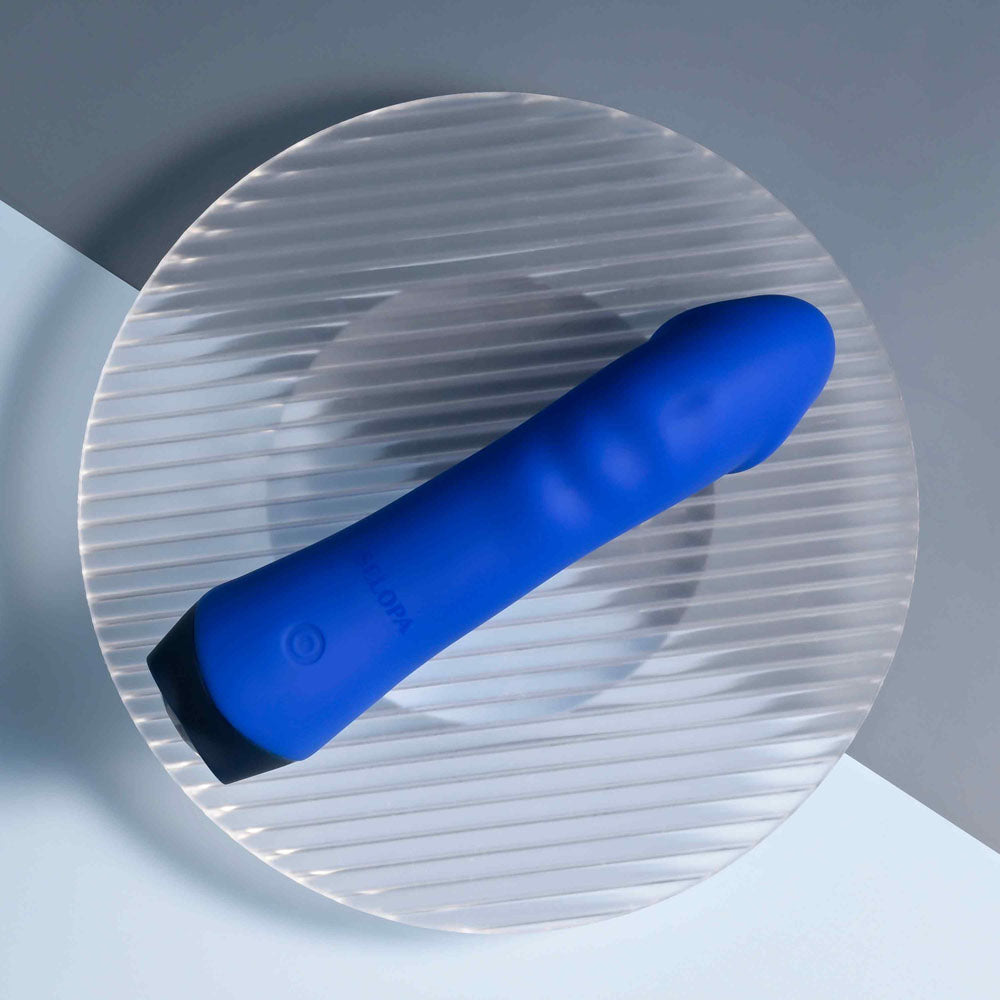 Selopa  BANGER -  13.6 cm USB Rechargeable Vibrator on a plate, showcasing its sleek blue design and curved texture.
