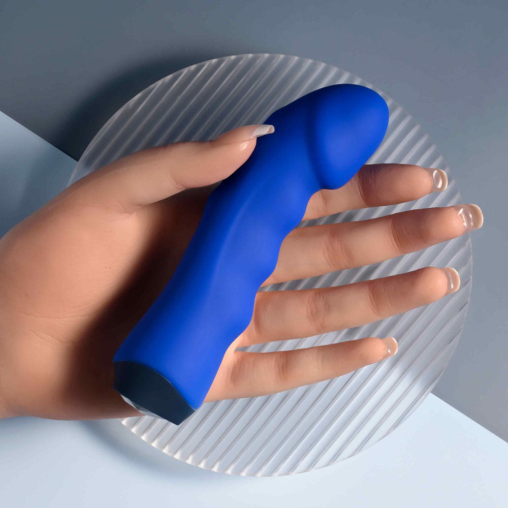 Selopa BANGER - 13.6 cm USB Rechargeable Vibrator resting on a hand, showcasing its curved and textured design.