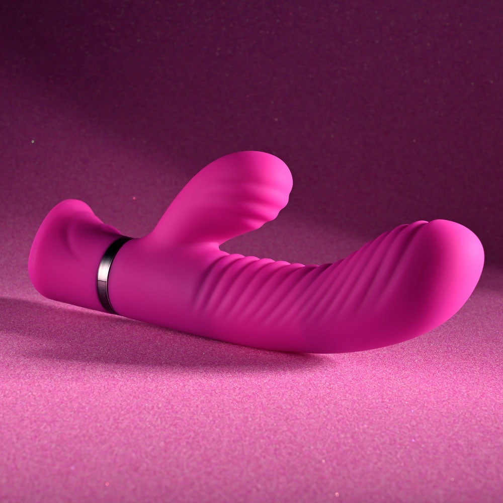 Selopa NEXT WAVE -  16.4 cm USB Rechargeable Dual Vibrator on a pink background for intimate essentials.
