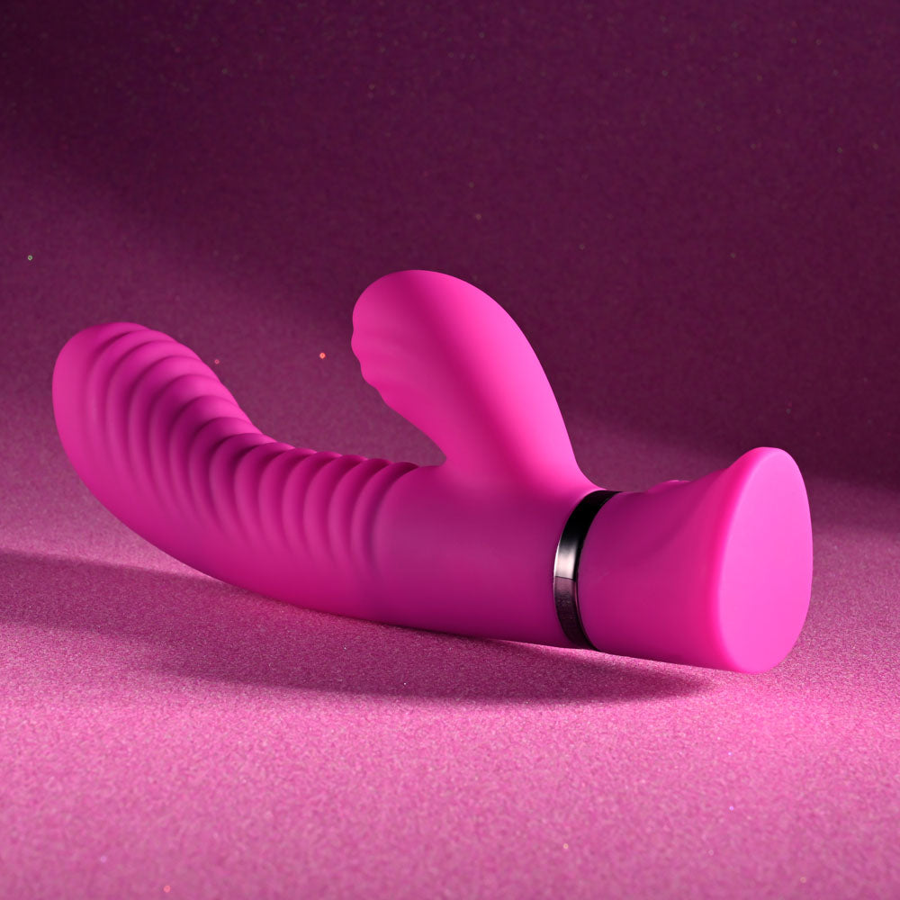 Selopa NEXT WAVE - 16.4 cm USB Rechargeable Dual Vibrator in vibrant pink with wavy grooves for stimulation.