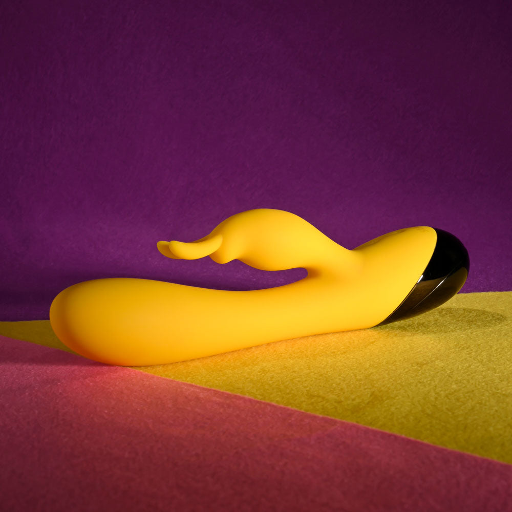 Selopa BUZZZ BUNNY - 19.7 cm USB Rechargeable Rabbit Vibrator on colorful background, showcasing its sleek design.