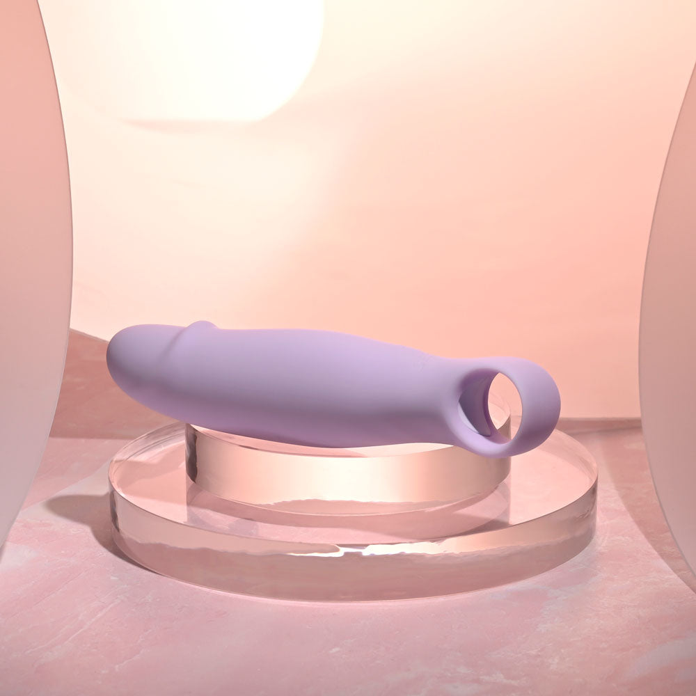 Selopa PETITE PECKER -  11.7 cm USB Rechargeable Mini Vibrator on display with soft lighting.