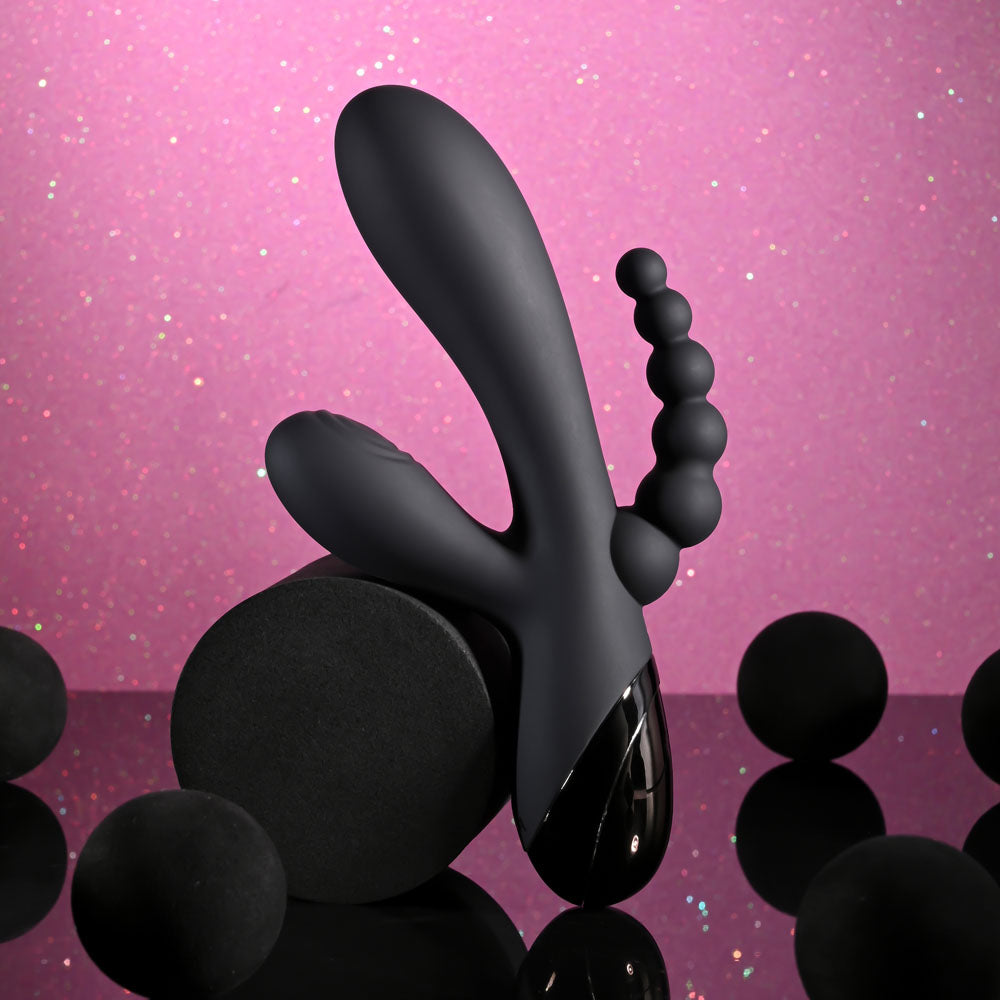 Selopa TRIPLE ACES - 19.7 cm USB Rechargeable Triple Stimulator Vibrator on a black background with soft lighting.