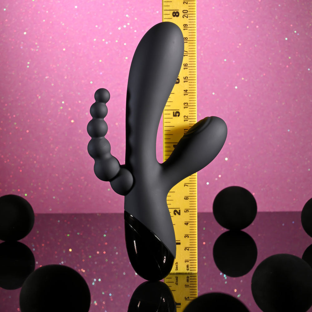 Selopa TRIPLE ACES -  19.7 cm USB Rechargeable Triple Stimulator Vibrator showcased with measuring ruler on a glittery background.