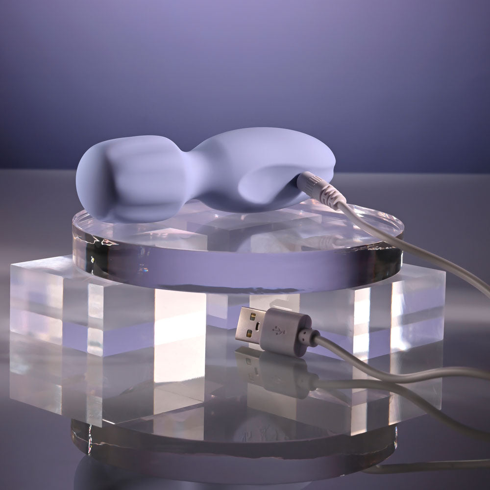 Selopa LIL' WAND - 11 cm USB Rechargeable Massage Wand charging on a crystal stand with USB cable.