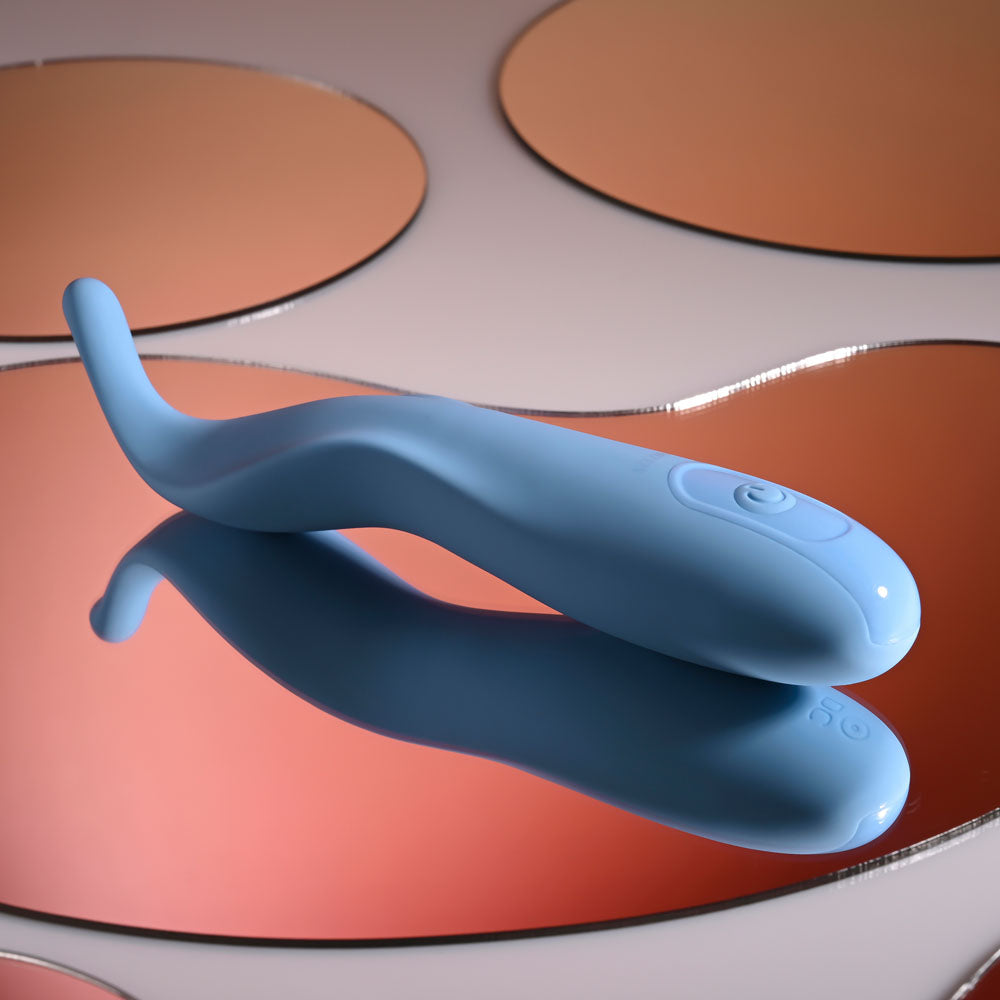 Selopa TENDER TICKLER -  16.2 cm USB Rechargeable Pinpoint Stimulator on reflective surface.