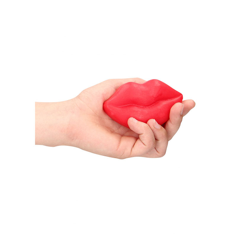 S-LINE Kiss Soap - Rose Scented Novelty Soap held in a hand, showcasing its bright red lip shape.