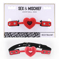 Sex & Mischief Amor Ball Gag - /Black Mouth Restraint featuring a heart-shaped gag on adjustable straps.