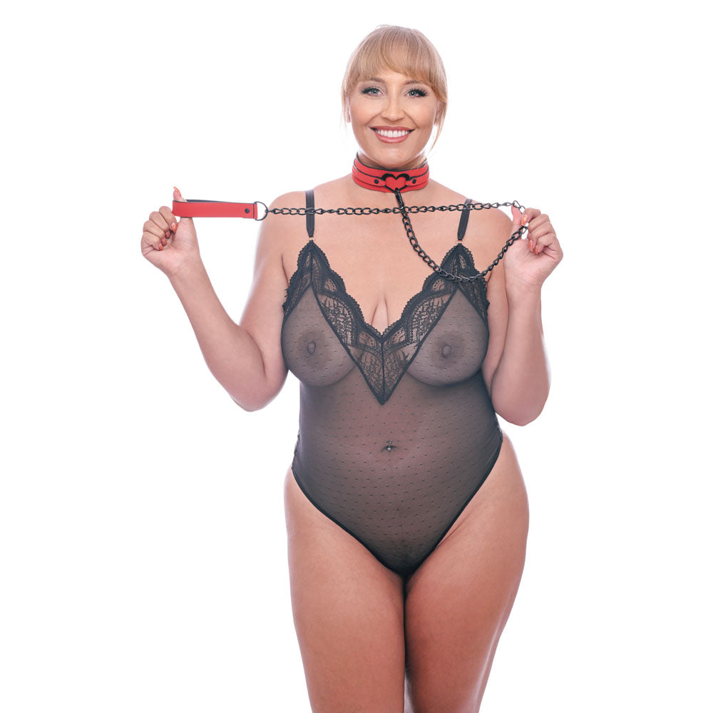 Model showcasing the Sex & Mischief Amor Collar and Leash - Restraint, styled in sexy black lace and red vegan leather.