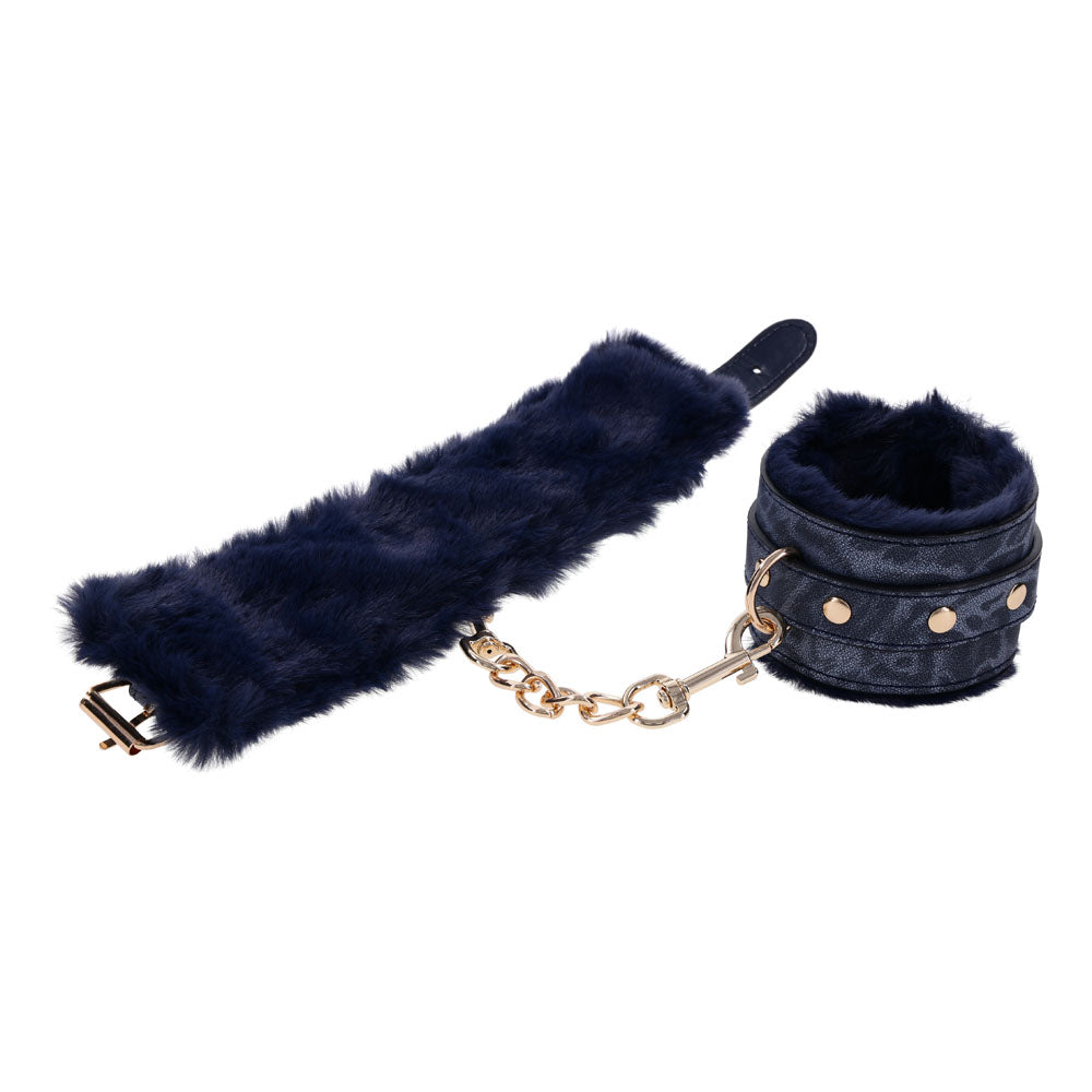 Sex & Mischief Cougar Fur Handcuffs - Navy /Gold Furry Restraints featuring luxurious blue faux fur and gold hardware.