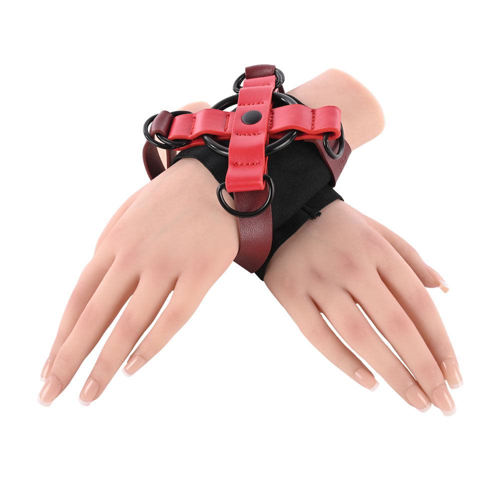 S&M Exs & Ohs Cross Cuffs - /Black Restraints with adjustable straps and a unique X-shaped design for thrill-seeking couples.