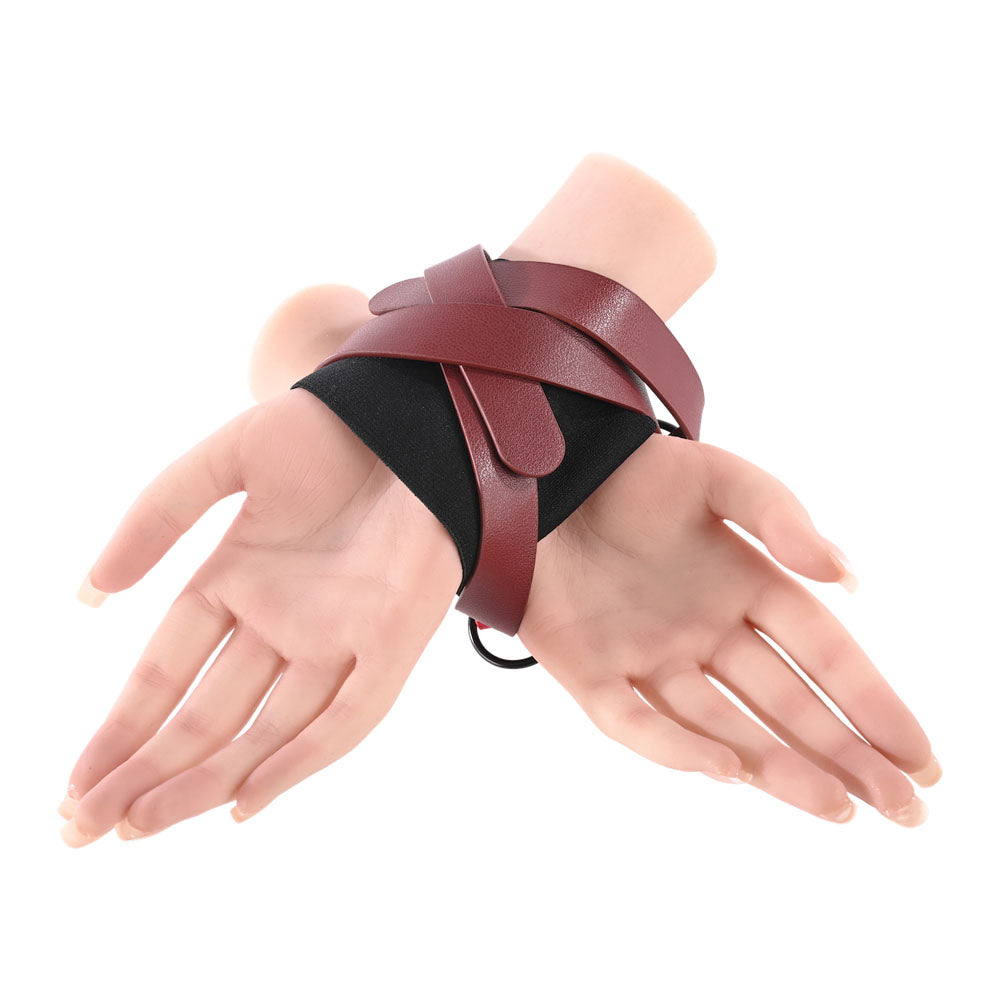 S&M Exs & Ohs Cross Cuffs - /Black Restraints showcasing adjustable cuffs with crisscross design for secure wrist binding.