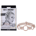 Sex & Mischief Peaches n CreaMe Ring Day Collar - Peach Bondage Collar displayed with packaging and model wearing it.