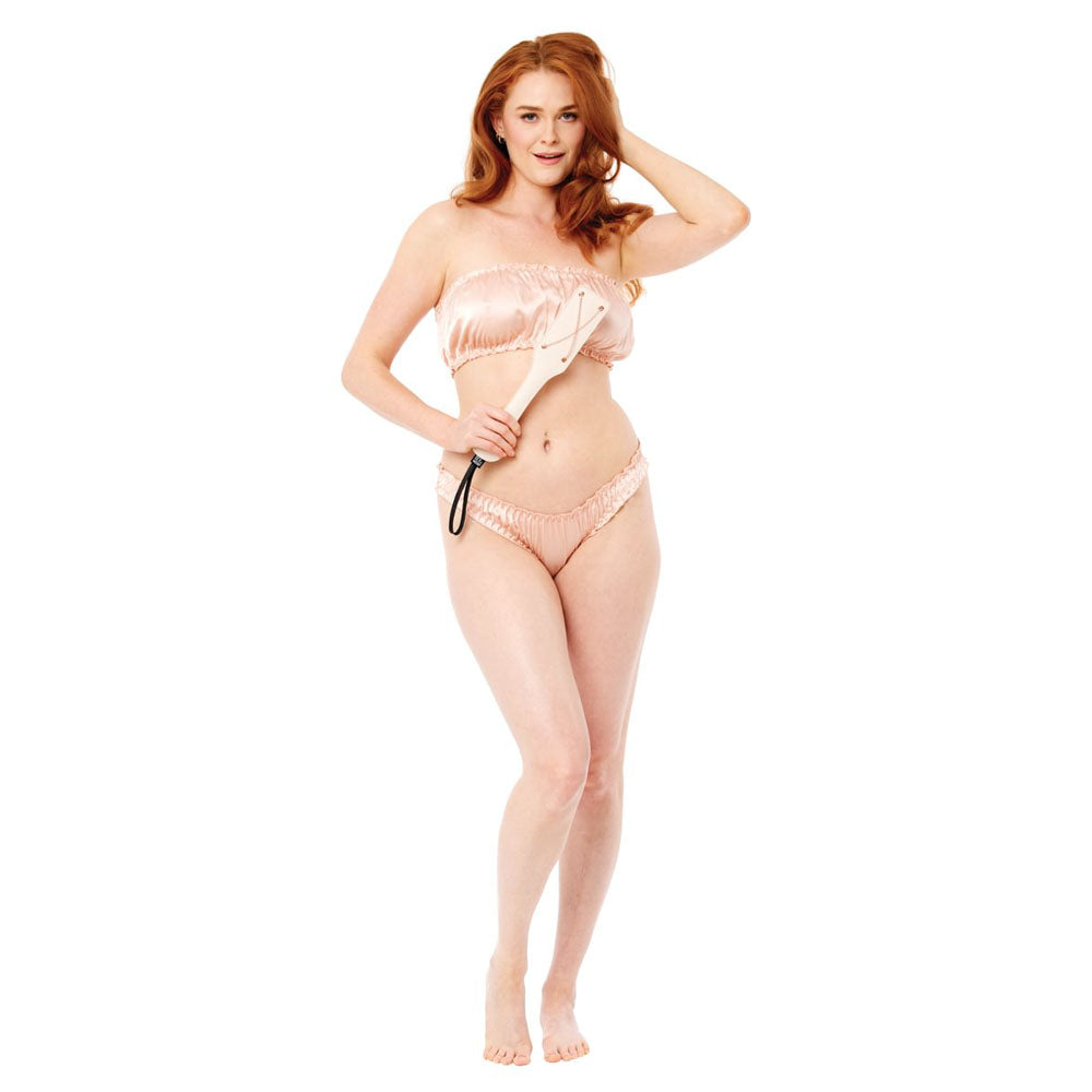 Model showcasing Sex & Mischief Peaches n CreaMe Chain Impressions Paddle - Peach Spanking Paddle while wearing intimate apparel.
